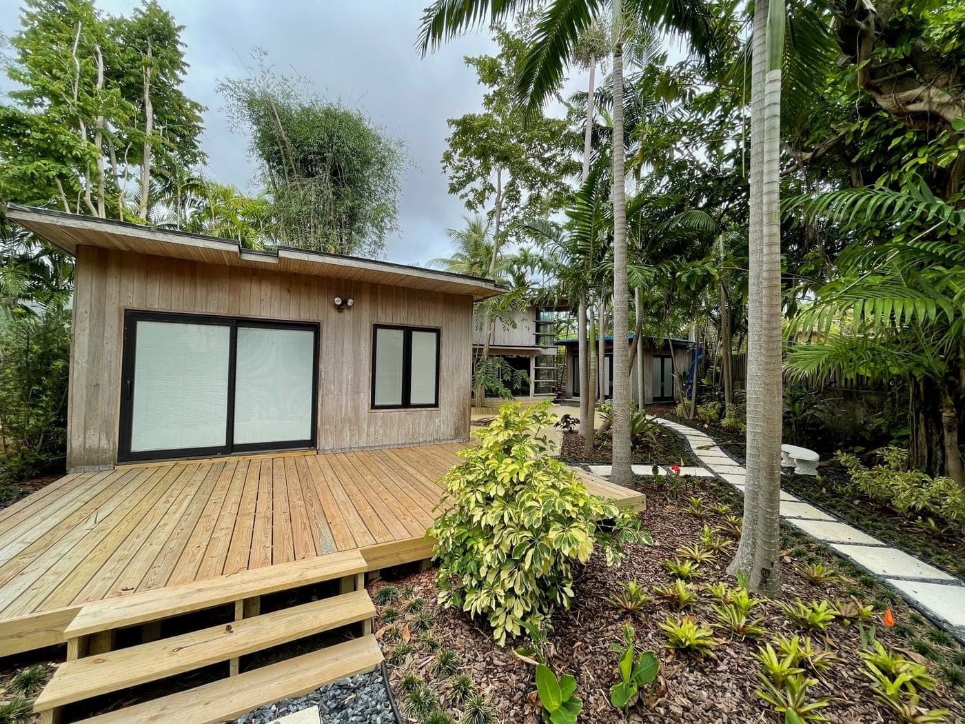 Alfred Browning Parker tropical modernist home. Cedar deck running along the glazed side of the house.