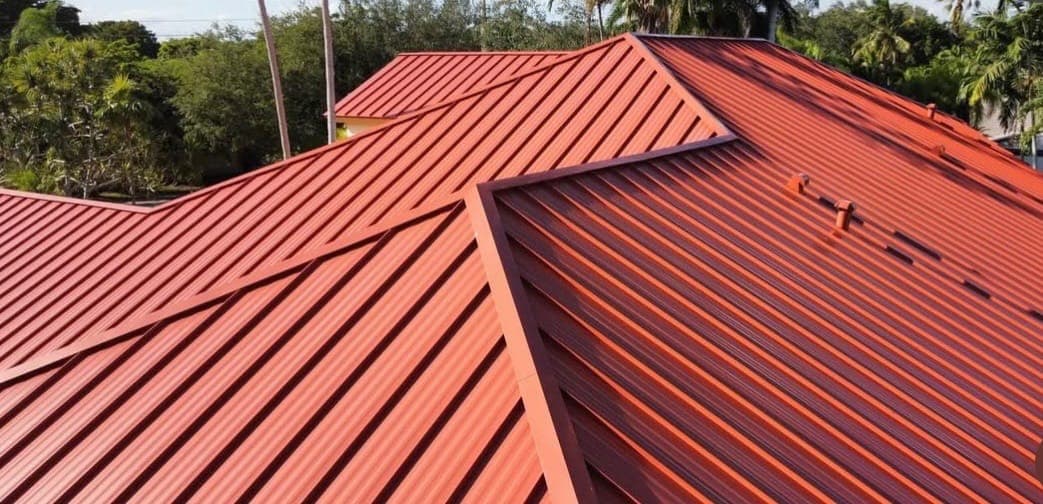 Red standing-seam metal roof detail.
