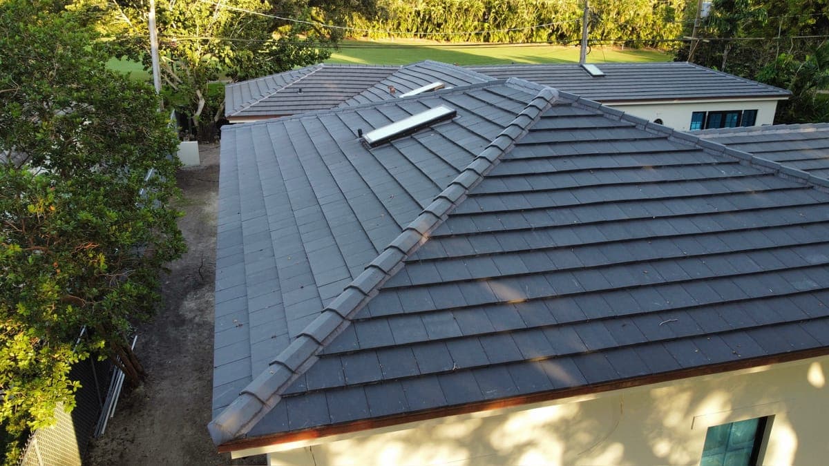 Aerial view of a dark flat-tile roof.