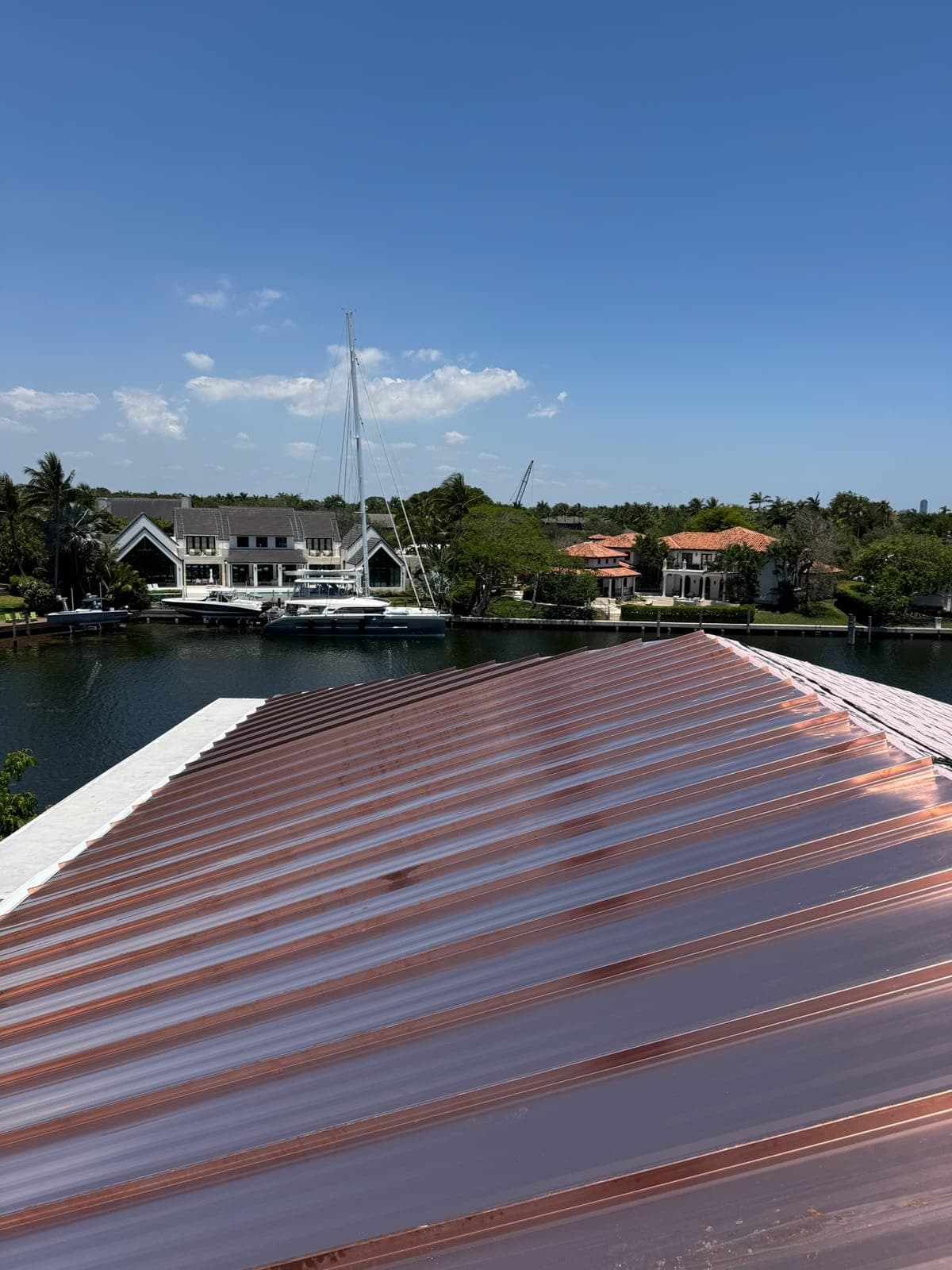 Copper metal roof on a waterfront property.
