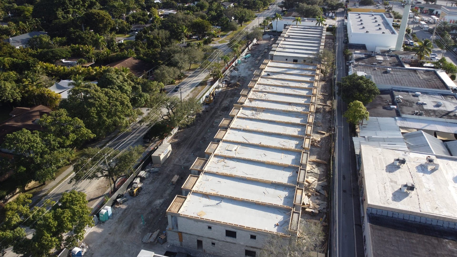 Aerial of a large commercial flat-roof project.