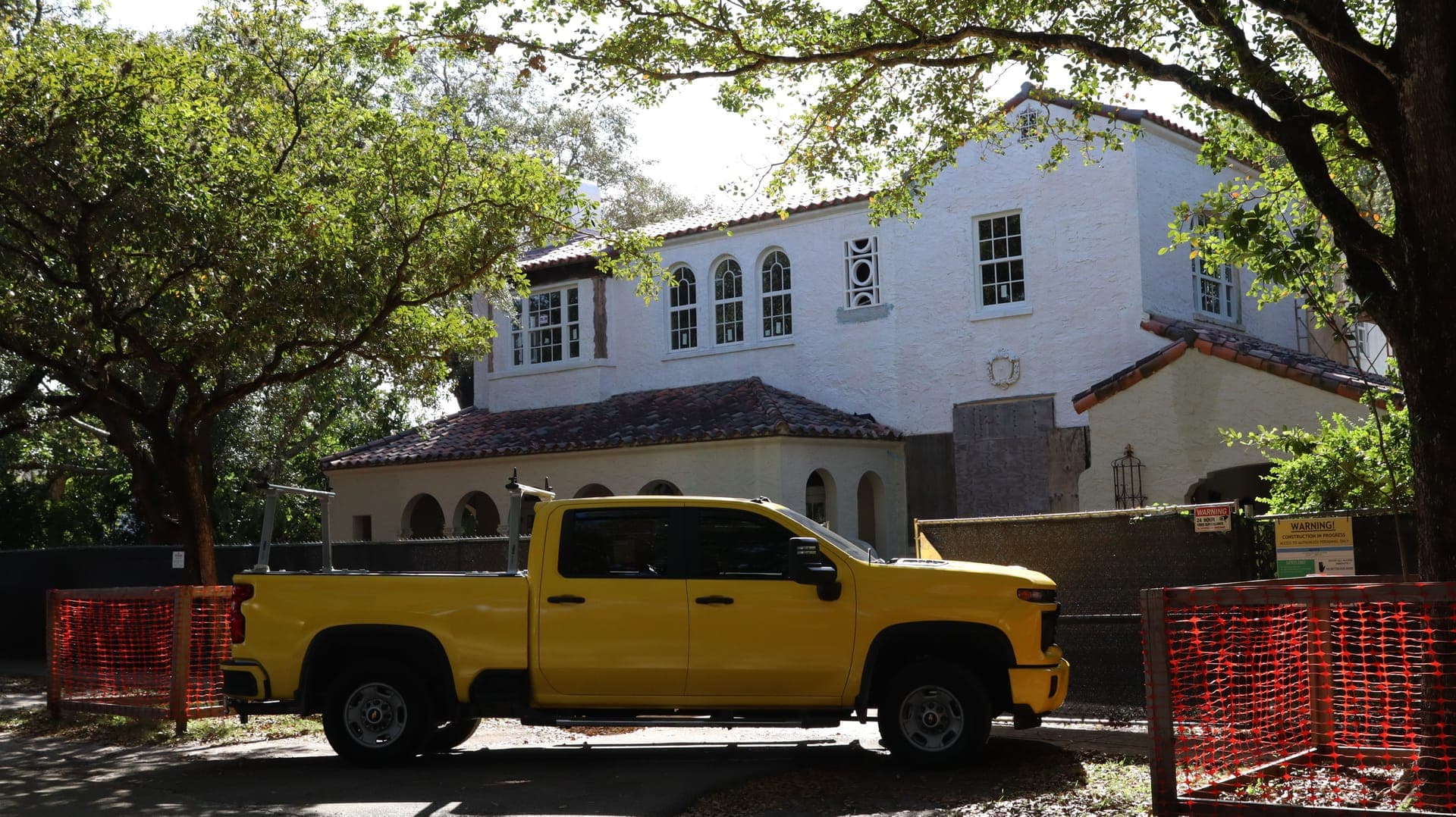 M. Romero's Roofing company truck at an active jobsite.